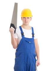 man in builder uniform and helmet with manual saw isolated on wh