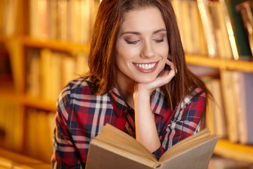 A portrait of a college student at library