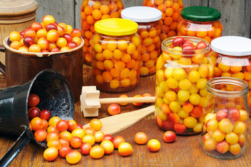 Preserving Mirabelle plums - jars of homemade fruit preserves