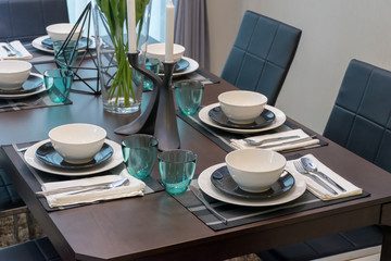 dining table and comfortable chairs in modern home with elegant