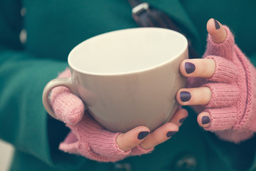Female Holding A Cup
