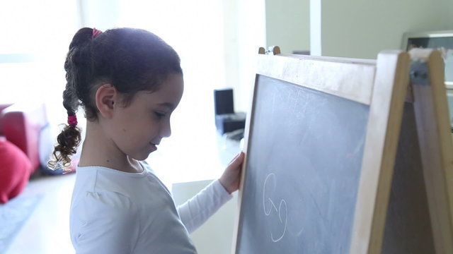 Girl writing on a board