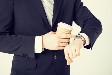 man looking at wristwatch