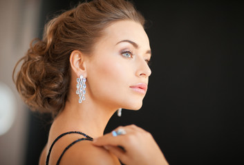 woman with diamond earrings