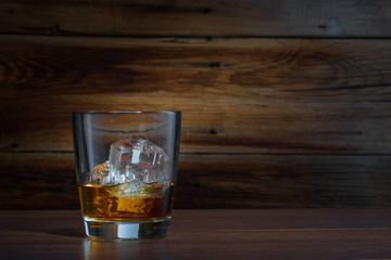whiskey on a wooden background
