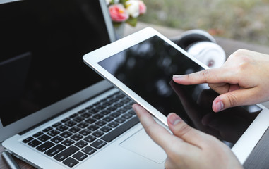 Woman hand hold white tablet with blank empty screen