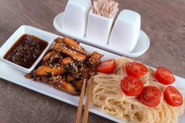 closeup pasta with chicken and sour-sweet sauce