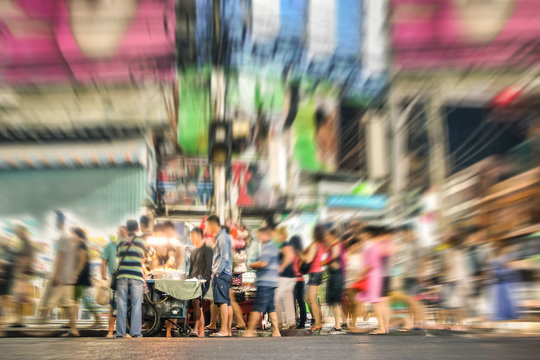 People on the road in Bangkok nightlife - Blurred image
