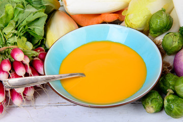 plate of pumpkin soup with vegetables
