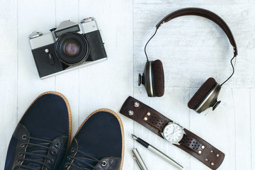 set of stylish men's accessories on a wooden background