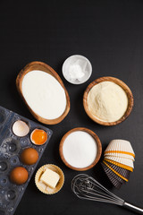baking ingredients on dark. yogurt, semolina, eggs & butter. kit