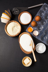 baking ingredients on dark. yogurt, semolina, eggs & butter. kit