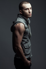 Obraz premium Portrait of handsome brutal young man with short hair & bristle