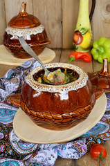 A pot of chicken and mushrooms