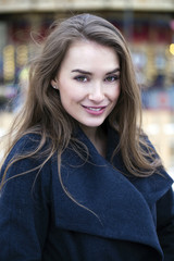 Obraz premium Young beautiful woman in stylish dark gray wool coat
