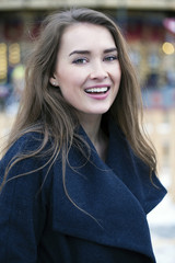 Young beautiful woman in stylish dark gray wool coat