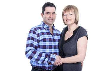 Studio portrait of happy seniors couple hugging. Isolated on whi