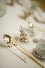 gold silver spoon chopsticks on the table