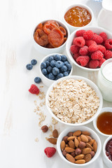 cereal and various delicious ingredients for breakfast, vertical