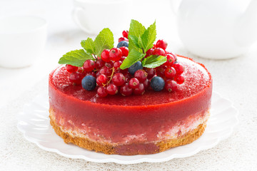 cheesecake with berry jelly on a plate