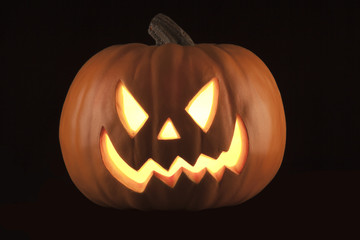 A beautiful pumpkin in a studio black background