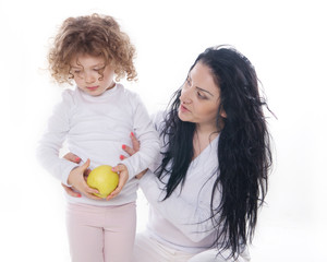 Fototapeta premium The child with mother holding apple isolated