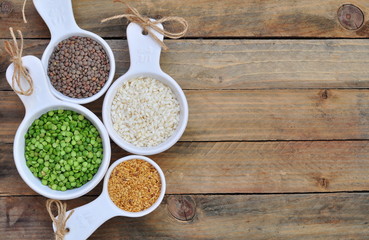 Different kinds of bean seeds on a wooden table