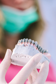 Dentist Working on a Denture