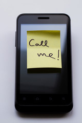 Yellow sticky note with  