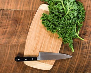 Green curly kale and knife