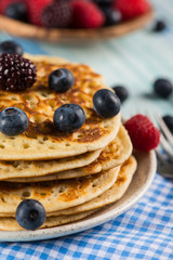 stack of fresh pancakes with fresh fruits