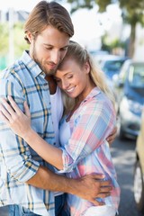 Obraz premium Attractive couple standing and hugging