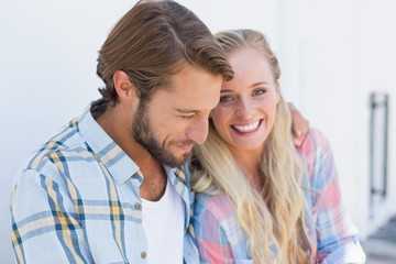 Attractive couple sitting on bench