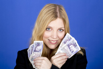 Model Released. Attractive Young Woman Holding Money