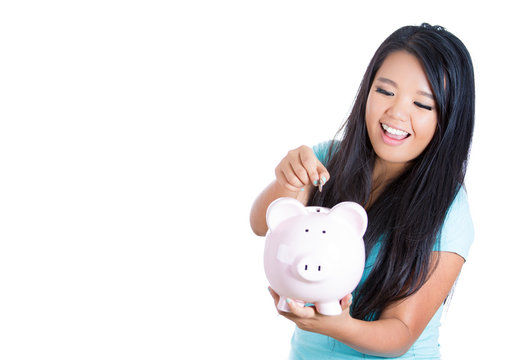 Young woman with piggy bank isolated on white background 
