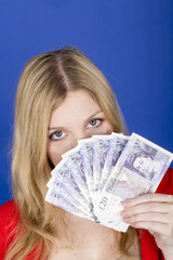 Model Released. Attractive Young Woman Holding Money