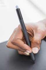 Hand of designer using stylus and digitizer