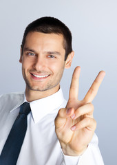 Businessman showing two fingers
