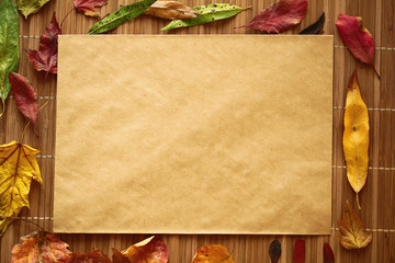 background dry yellow leaves on a wooden background