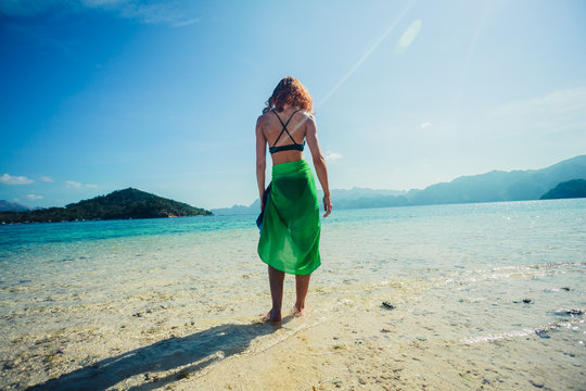 Woman wearing sarong on tropical beach