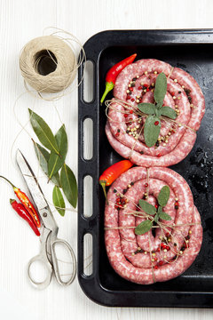 homemade raw sausage with herbs aromatic & fresh red pepper. rea