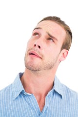 Obraz premium Thoughtful man in shirt looking up