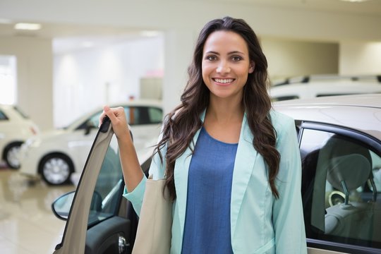 Pretty Customer Standing Next To Her Car