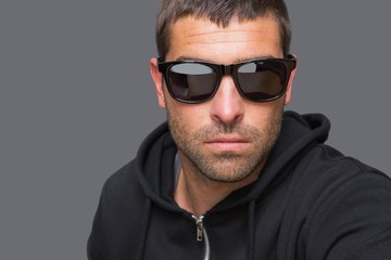 Obraz premium Criminal with sunglasses looking at camera