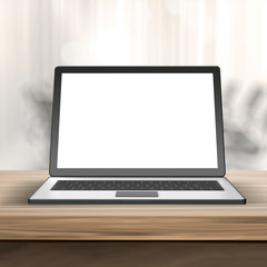 Fototapeta premium Laptop with blank screen on wood table and blurred background