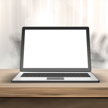 Laptop with blank screen on wood table  and blurred  background