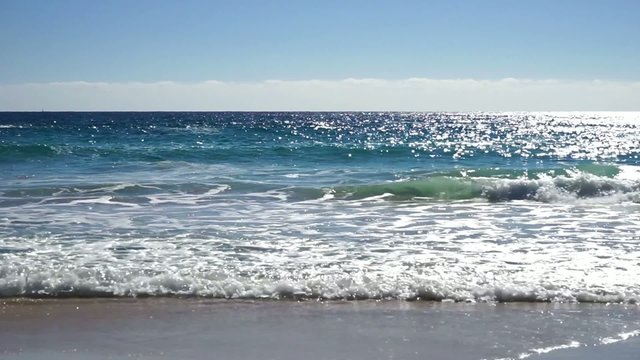 idyllic shore beach with blue clear water