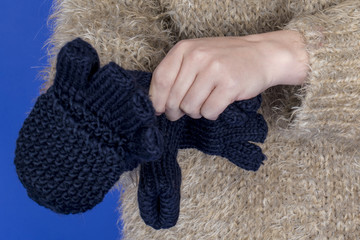 Model Released. Attractive Young Woman Putting on Gloves