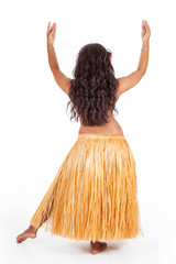 Young hula dancer seen from behind