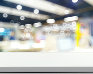 Empty laminate shelf and blurred background for business product